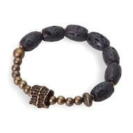 Bracelet femme avec perles noires volcaniques ovales et petites perles en laiton doré, design artisanal original.