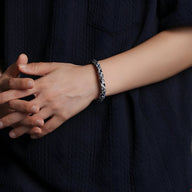 Bracelet mixte en polyester tissé noir et blanc avec motif distingué, modèle Marley.