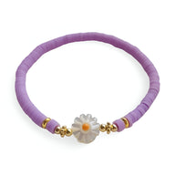 Bracelet en résine violet avec fleur marguerite blanche centrale et accents dorés délicats.
