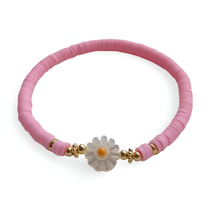 Bracelet rose en résine avec ornement marguerite blanc et perles dorées délicates.