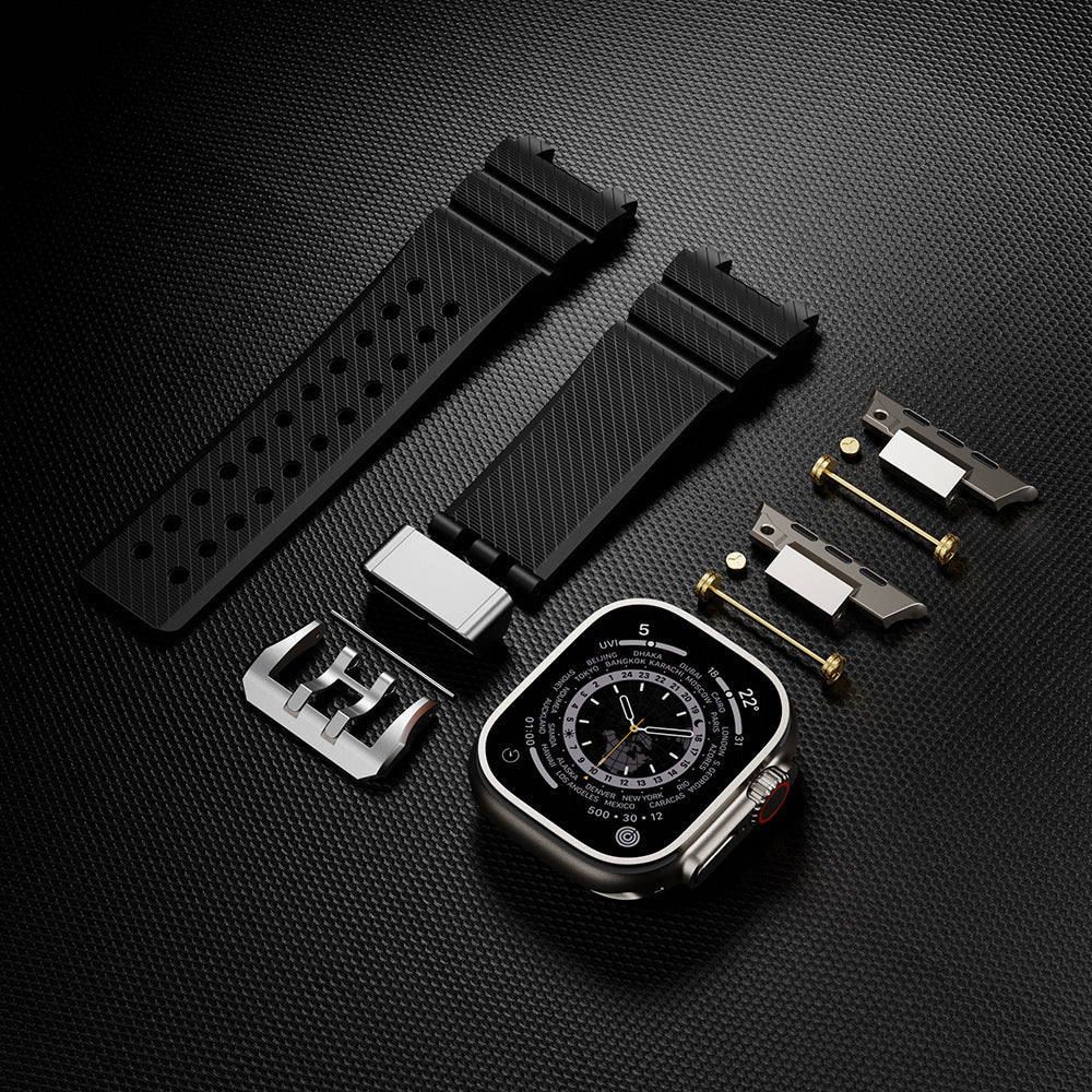 Bracelet silicone noir à détails or technique pour Apple Watch avec accessoires de fixation et boucle métalliques argentées.