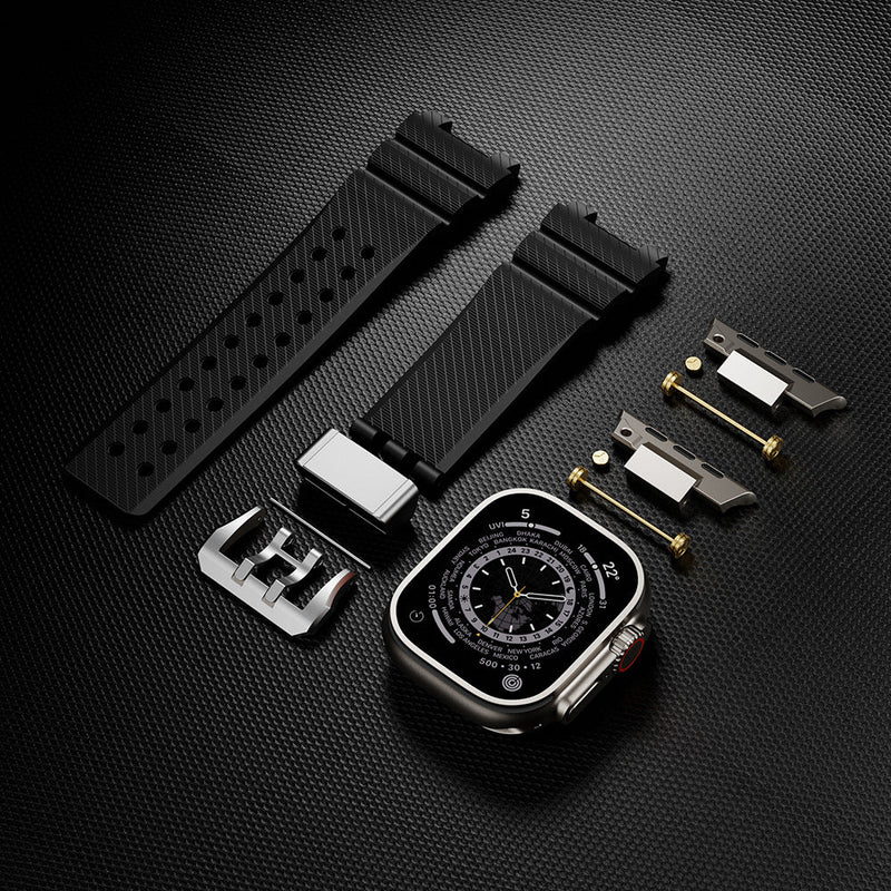 Bracelet silicone noir à détails or technique pour Apple Watch avec accessoires de fixation et boucle métalliques argentées.