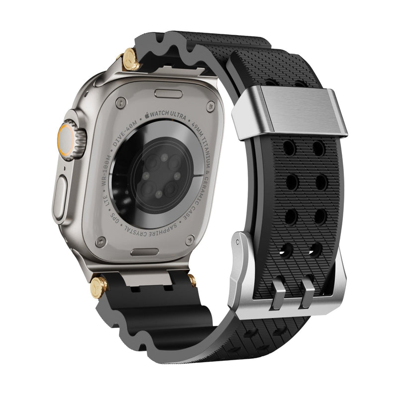 Bracelet Apple Watch noir en silicone texturé avec détails dorés et boucle argentée ajustable.