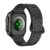 Bracelet silicone noir à aspect technique avec maillons pour Apple Watch, ajustable et haute résistance.