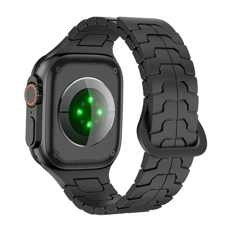 Bracelet silicone noir à aspect technique avec maillons pour Apple Watch, ajustable et haute résistance.