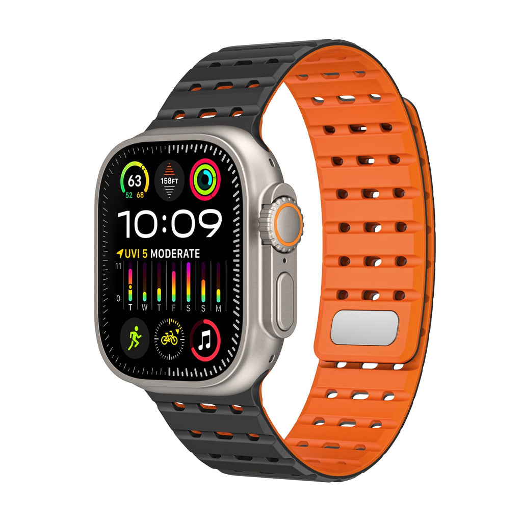 Bracelet silicone noir et orange perforé, style sportif, ajustable pour Apple Watch.
