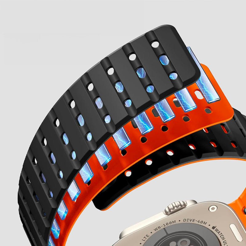 Bracelet Apple Watch silicone noir et orange perforé, design sportif et ajustable.