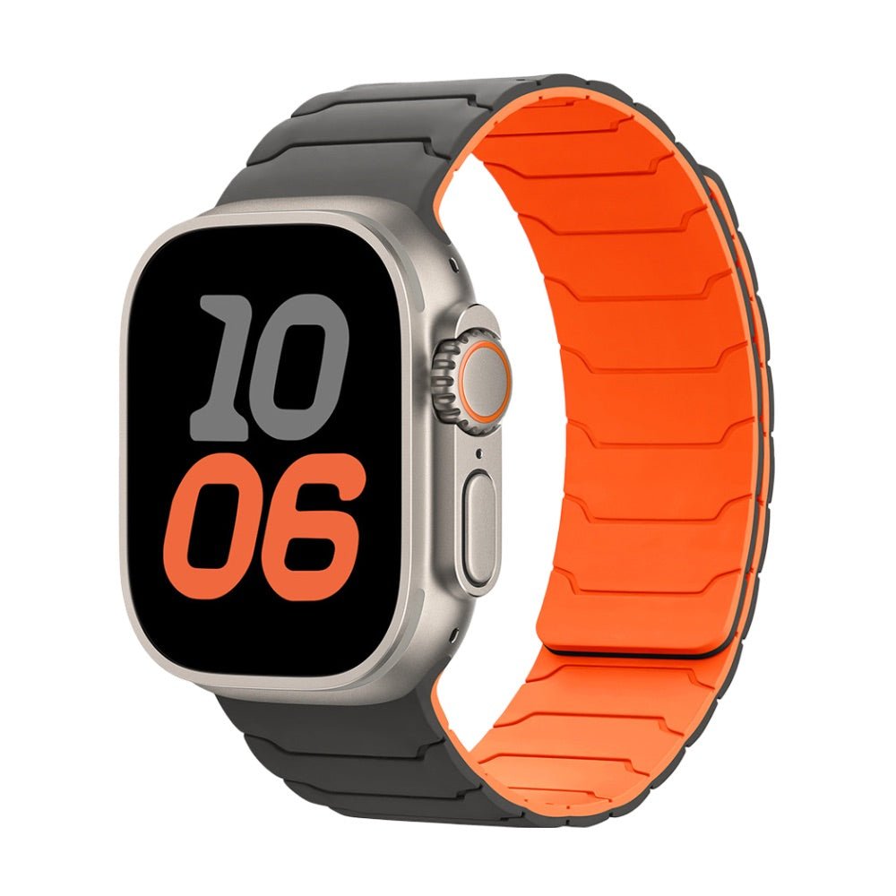 Bracelet silicone magnétique noir et orange pour Apple Watch, design pro ajustable, intérieur orange vif, extérieur noir mat.