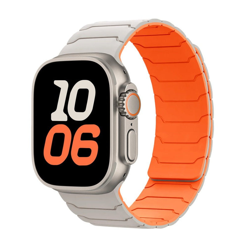 Bracelet en silicone gris clair avec intérieur orange pour Apple Watch, design magnétique ajustable.