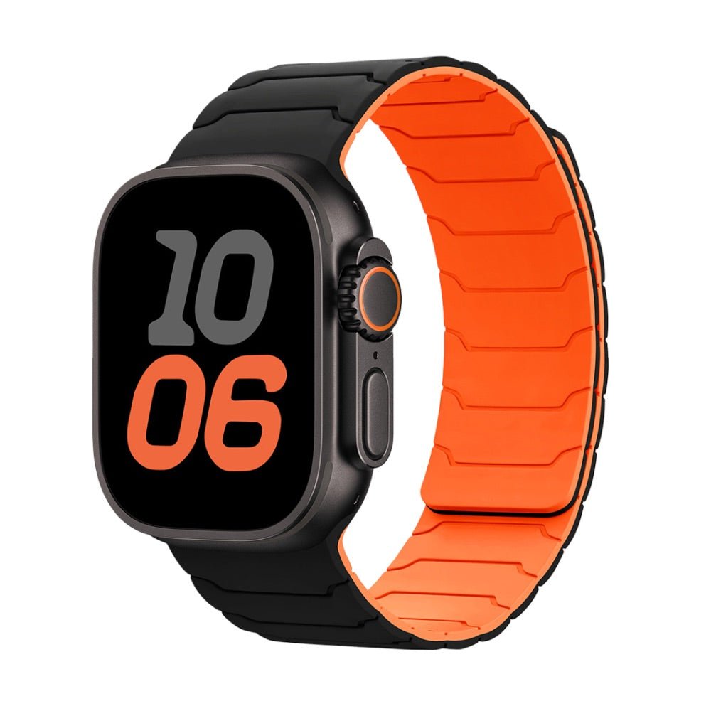 Bracelet en silicone magnétique noir à l’extérieur et orange à l’intérieur pour Apple Watch, design ajustable et résistant.