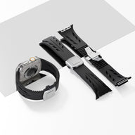 Bracelet silicone noir avec fermeture papillon argent pour Apple Watch, design ajouré et ajustable.