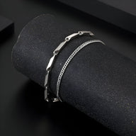 Bracelet homme en titane argenté double chaîne avec maillons lisses et style chaîne fine.