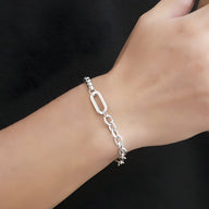 Bracelet homme en titane argenté à double maille robuste avec maillons ovales et ronds.