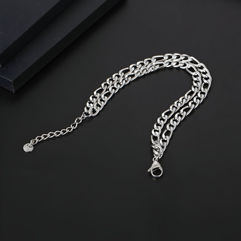 Bracelet homme en titane argenté maille figaro double prestance avec fermoir mousqueton.
