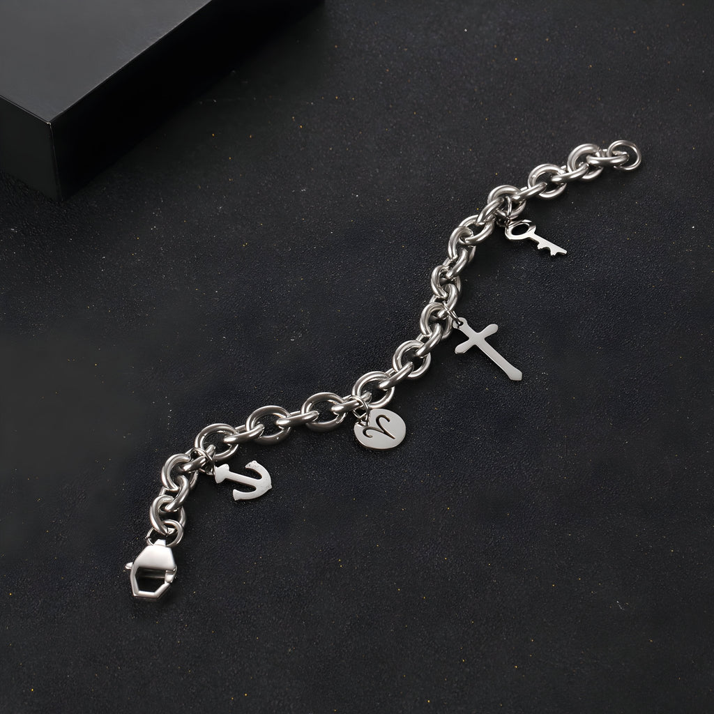 Ancre, cadenas, cœur et croix.