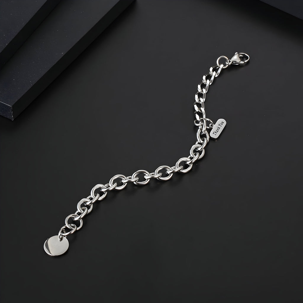 Bracelet homme en titane argenté avec maille forçat et médaille ronde lisse.
