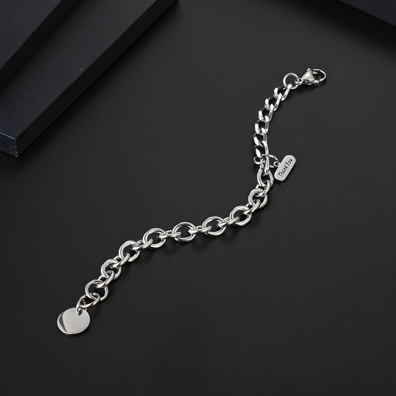 Bracelet homme en titane argenté avec maille forçat et médaille ronde lisse.