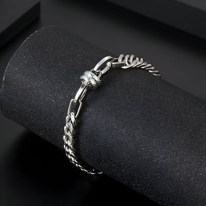 Bracelet homme en titane argenté, maille spiga fine avec noeud décoratif central.