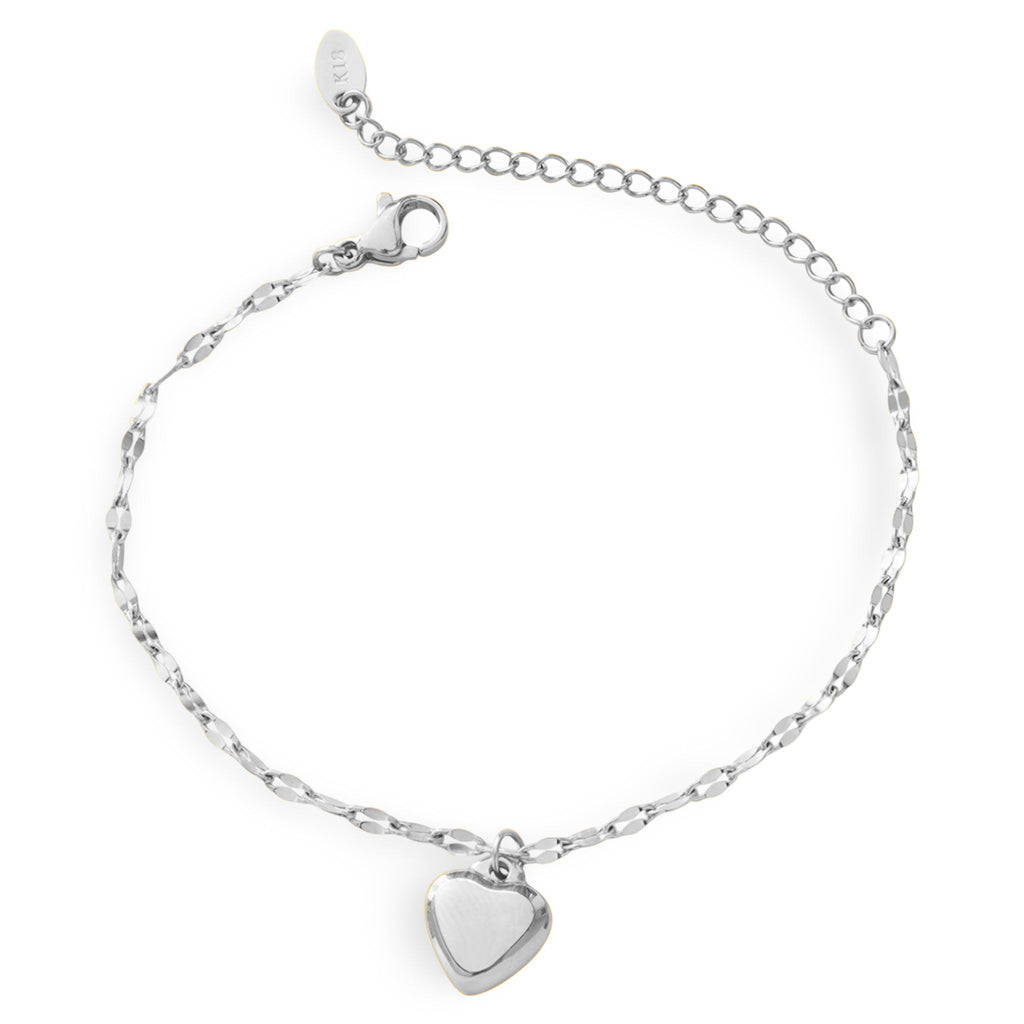 Bracelet en titane argenté avec petit pendentif cœur lisse et chaîne fine élégante.