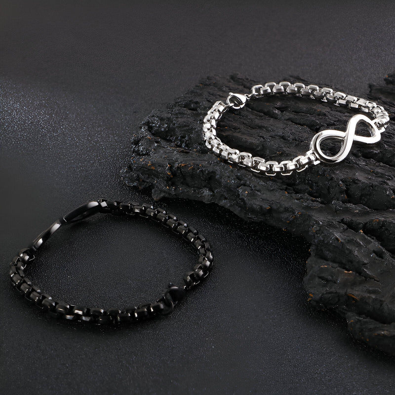 Bracelet en titane noir à perles et bracelet argenté avec motif infini en chaîne robuste.