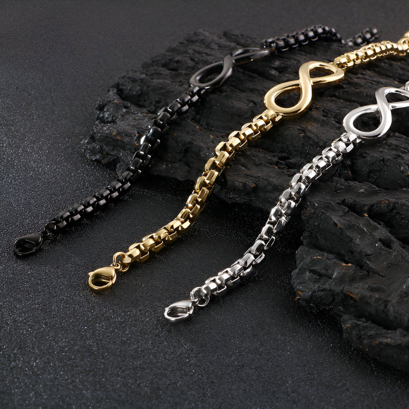 Trois bracelets en titane avec motif infini, en noir, or et argent, style chaîne élégante.