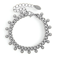 Bracelet en titane argenté chaîne épaisse avec petites perles rondes suspendues.