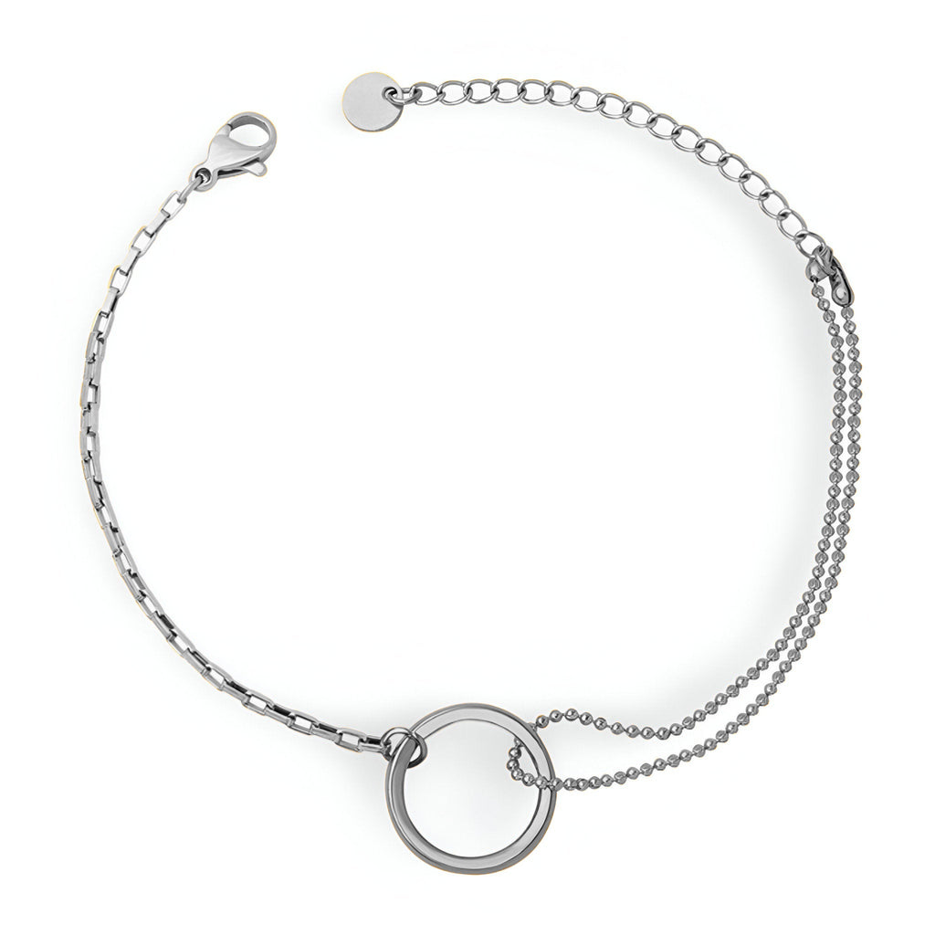 Bracelet fin en titane argent avec double chaîne et anneau circulaire minimaliste.