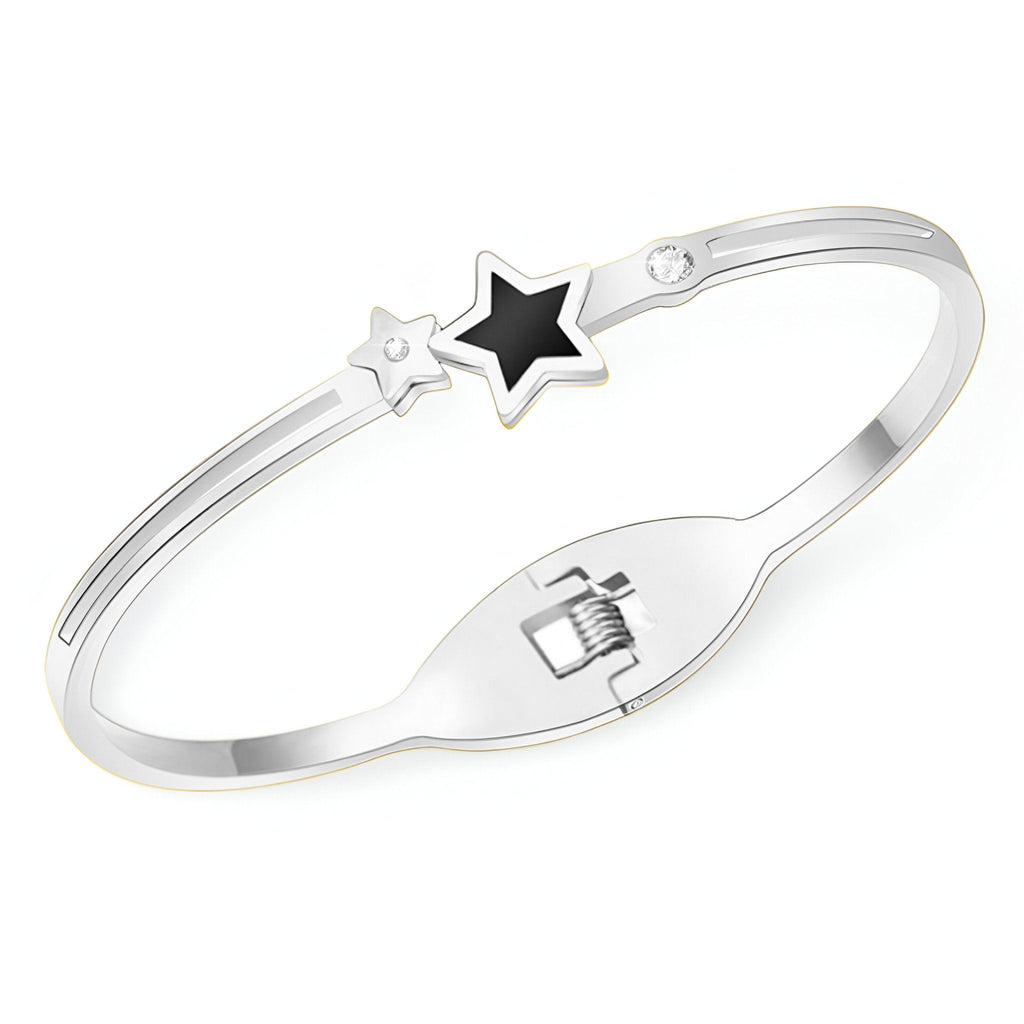 Bracelet jonc en titane plaqué argent avec étoile noire et petite étoile argentée détaillée.