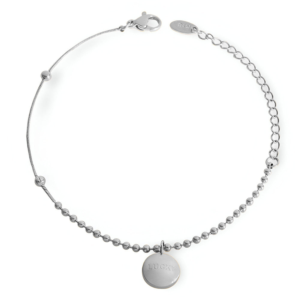 Bracelet argenté à billes fines avec médaillon rond lisse et chaîne réglable.