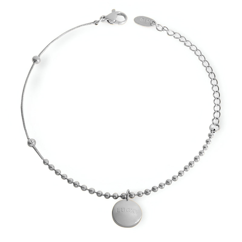 Bracelet argenté à billes fines avec médaillon rond lisse et chaîne réglable.