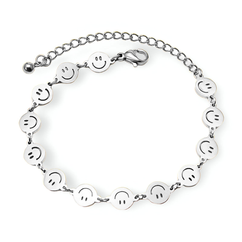 Bracelet femme argenté en titane plaqué avec motif smileys ronds et chaîne ajustable.