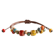 Bracelet estivale en perles de céramique, cordon ciré, formes abstraites, look moderne, modèle Saloua - La Boutique du Bracelet