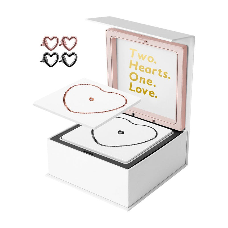 Bracelets éternels en acier inoxydable, forme cœur, noir et rose, présentés dans un coffret blanc avec message doré.