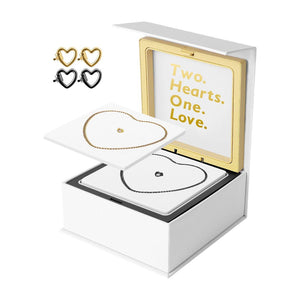Bracelets en acier inoxydable noir et doré en forme de cœur, boîte blanche avec intérieur doré et message "Two Hearts.