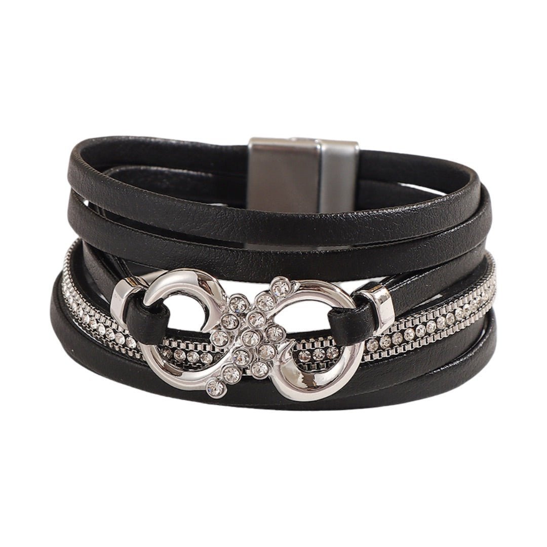 Bracelet multi-rangs noir en simili vegan avec strass, motif infini argenté et fermoir magnétique élégante.