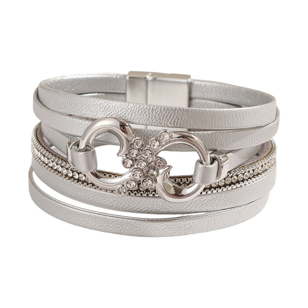 Bracelet multi-rangs argenté en simili vegan avec strass et fermoir magnétique, motif infini au centre.