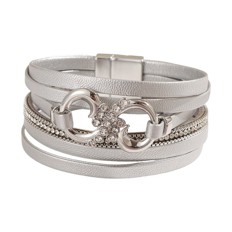 Bracelet multi-rangs argenté en simili vegan avec strass et fermoir magnétique, motif infini au centre.