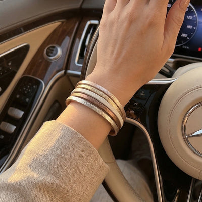 Women's multi-strap leather bracelet, gold and brown designer cuff bracelet, elegant accessory with magnetic clasp, Elyra model