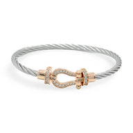 Bracelet fer à cheval en titane argenté avec fermoir or rosé serti de cristaux, modèle Annabelle.