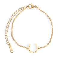Bracelet femme en acier inoxydable doré avec pendentif fer à cheval fin et chaîne ajustable.