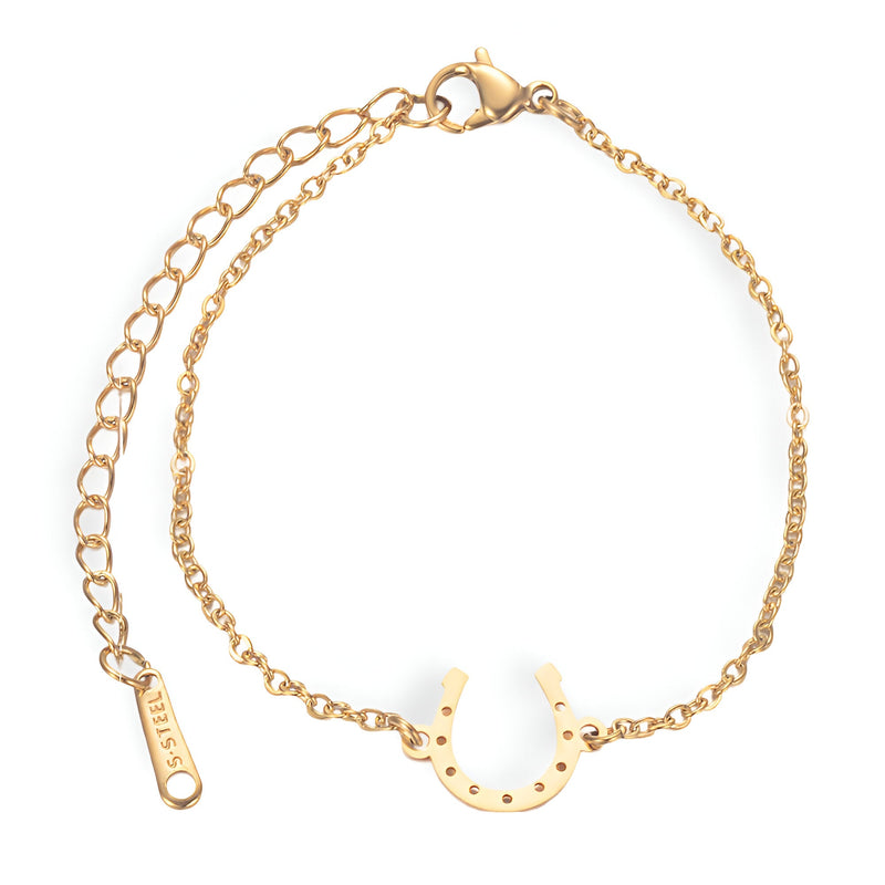 Bracelet femme en acier inoxydable doré avec pendentif fer à cheval fin et chaîne ajustable.