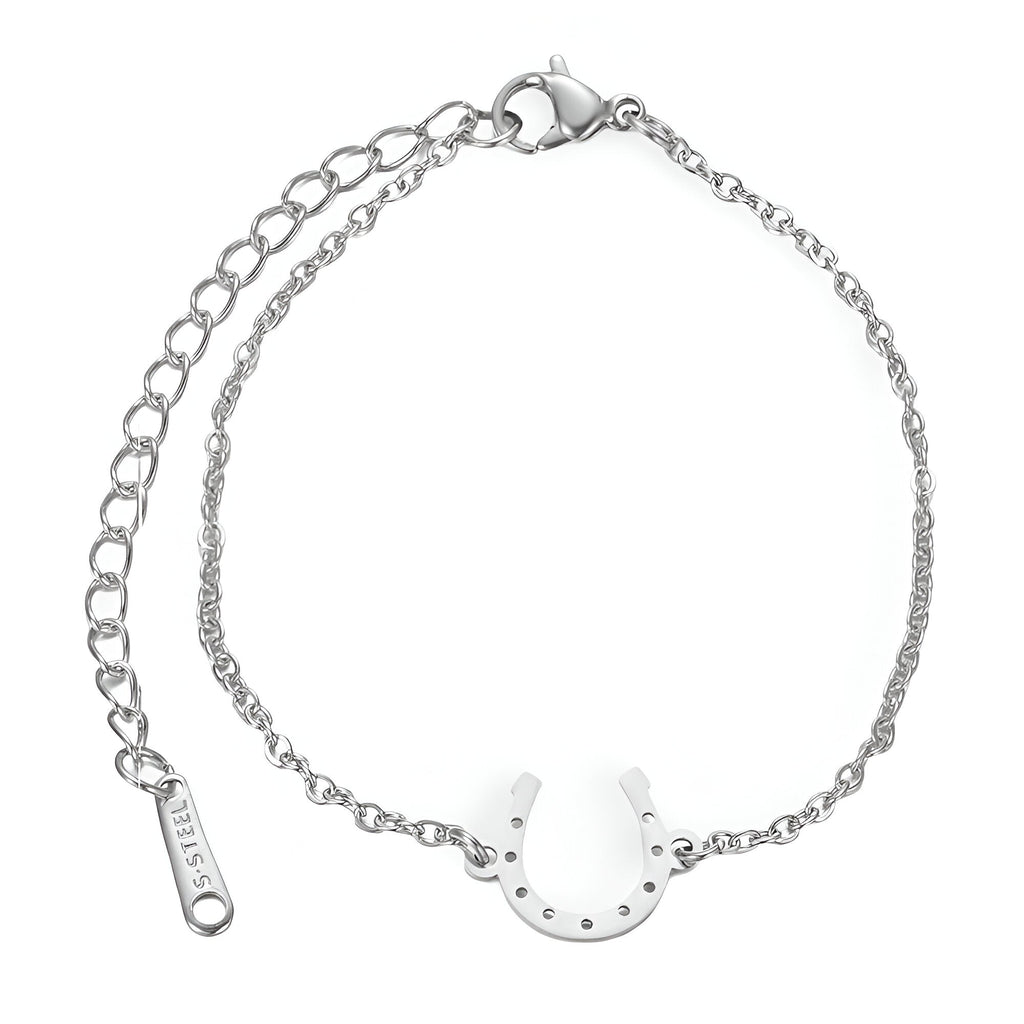 Bracelet en acier inoxydable argenté avec pendentif fer à cheval poli et chaîne fine réglable.