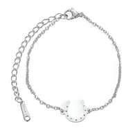 Bracelet en acier inoxydable argenté avec pendentif fer à cheval poli et chaîne fine réglable.