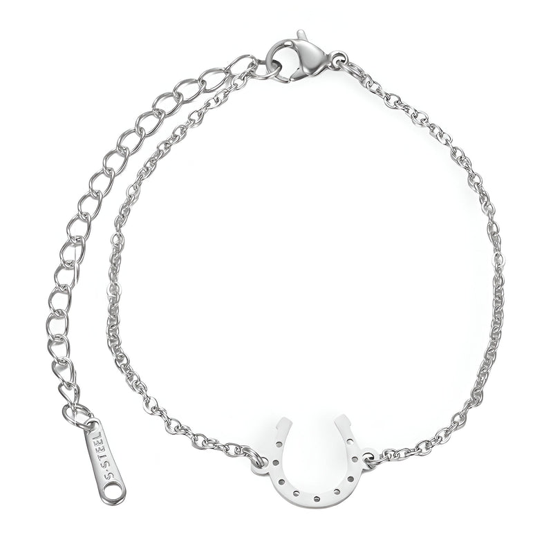 Bracelet en acier inoxydable argenté avec pendentif fer à cheval poli et chaîne fine réglable.