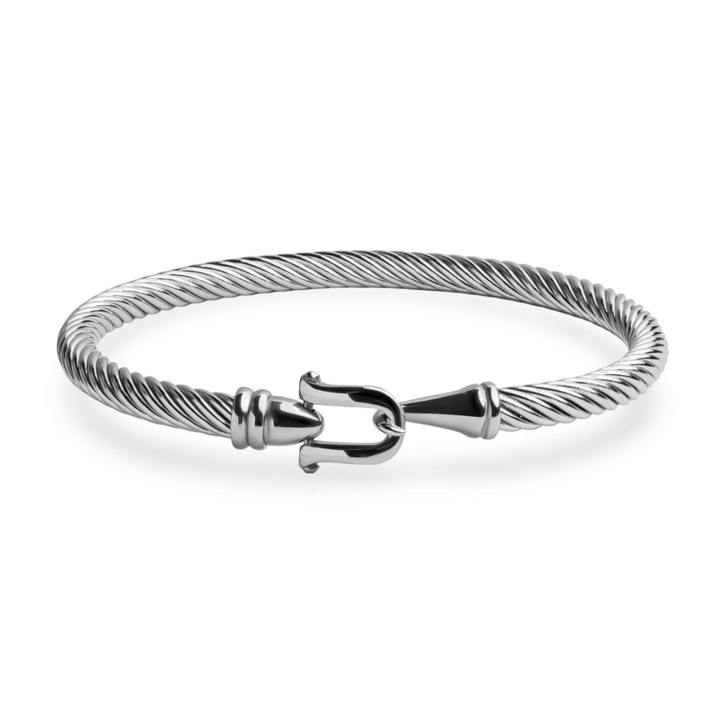 Bracelet fer à cheval en acier inoxydable argenté, tresse fine et fermoir en forme de fer à cheval.