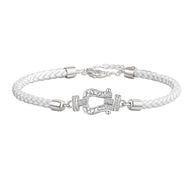 Bracelet femme en argent sterling tressé blanc avec fermoir fer à cheval orné de zircons étincelants.