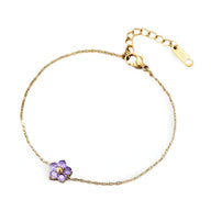 Bracelet femme chaîne fine acier inoxydable avec fleur colorée violette zirconiums.