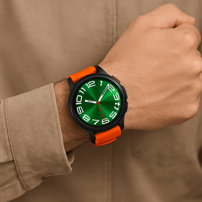 Bracelet de montre Garmin sportif orange en nylon résistant avec boucle noire à attache rapide.