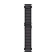 Bracelet montre Garmin en nylon ondulé noir avec système de libération rapide, style sport et outdoor, largeur adaptable.