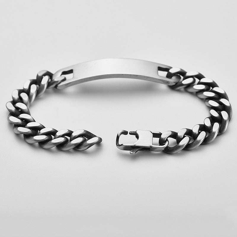 Bracelet gourmette en acier inoxydable anthracite avec plaque centrale lisse et maillons larges, modèle mixte Quinn.